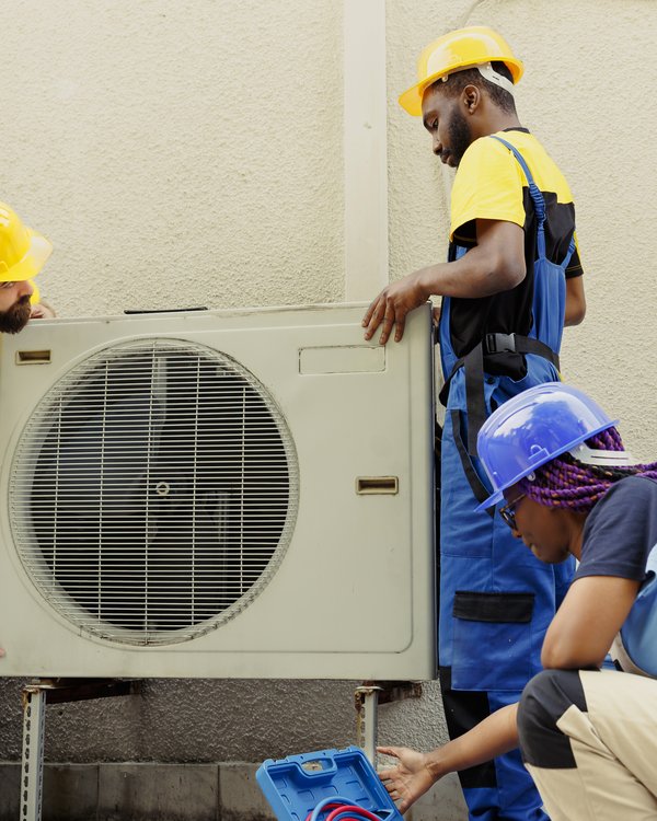 HVAC team replacing air conditioning unit